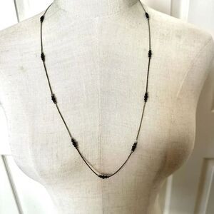 Black and silver tone long beaded necklace